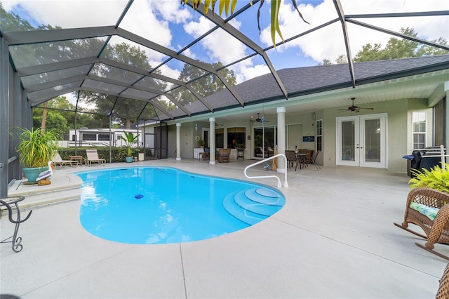 view of pool with ceiling fan, french doors, a patio area, and a grill