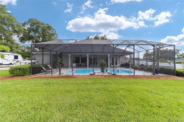 exterior space featuring a lanai, a patio, and a yard