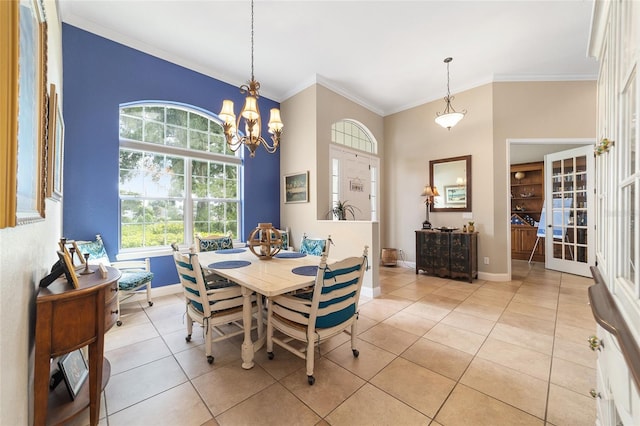 dining room featuring ornamental molding, a chandelier, and light tile patterned floors