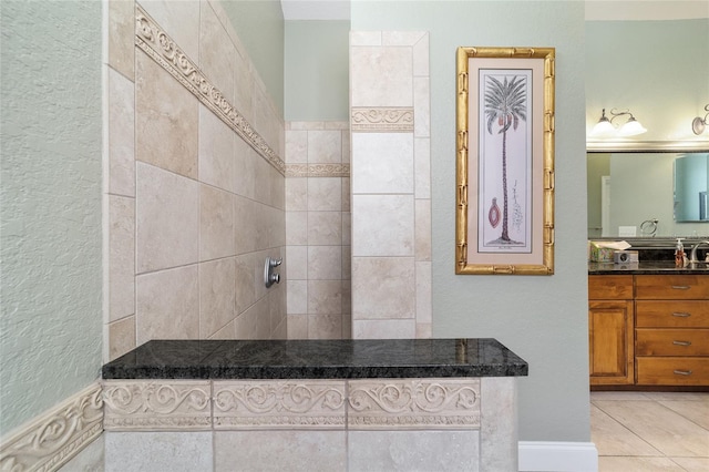 bathroom featuring tile patterned flooring and vanity