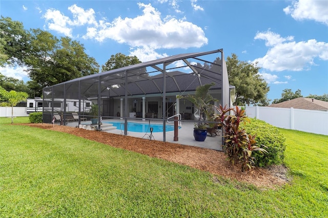 exterior space featuring glass enclosure, a fenced in pool, and a lawn