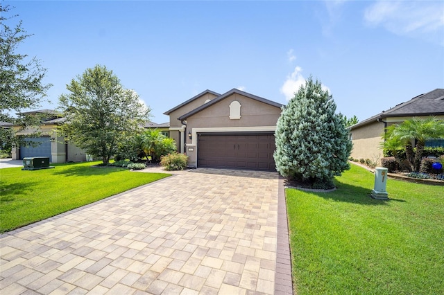 view of front facade with a front lawn and a garage