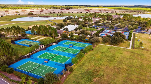 birds eye view of property with a water view