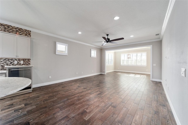 unfurnished living room with wood-type flooring, a textured ceiling, ceiling fan, and crown molding