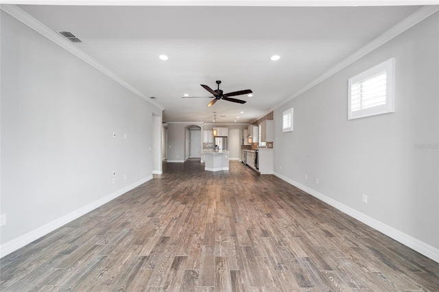 unfurnished living room with dark hardwood / wood-style flooring and ornamental molding