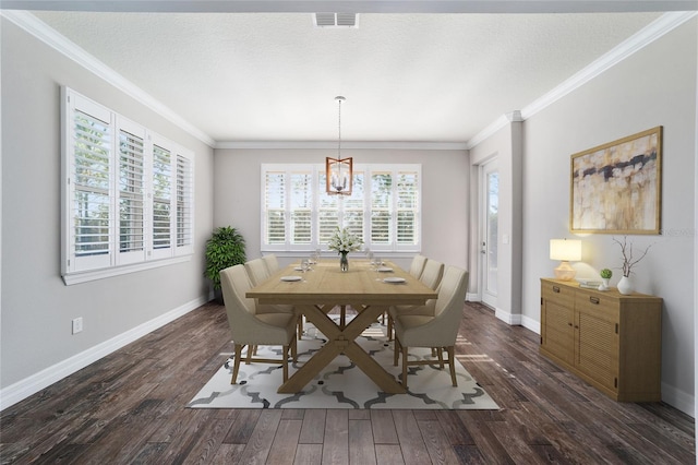 dining area with a notable chandelier, dark hardwood / wood-style floors, crown molding, and a textured ceiling