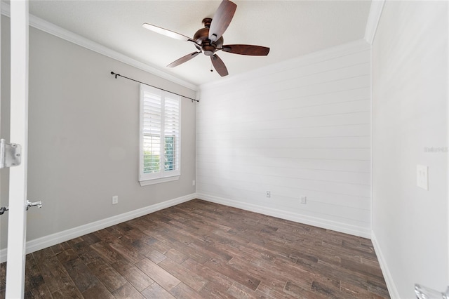 spare room featuring ornamental molding, ceiling fan, and dark wood-type flooring