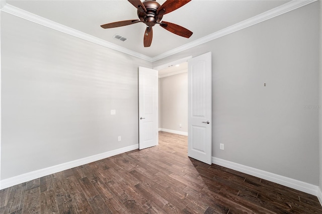 empty room featuring ceiling fan, dark hardwood / wood-style flooring, and ornamental molding