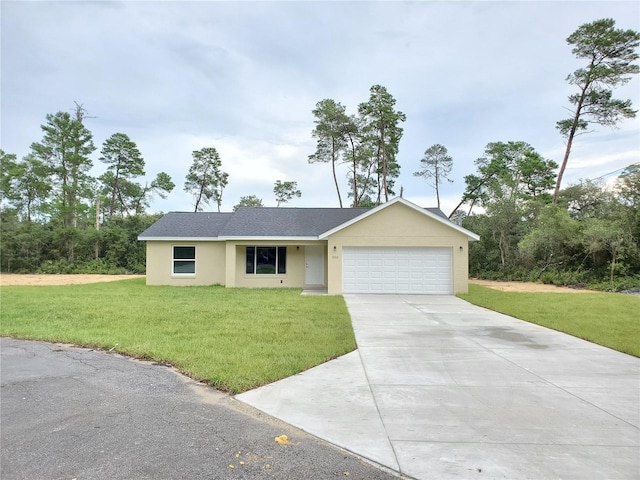 ranch-style home with a garage and a front yard