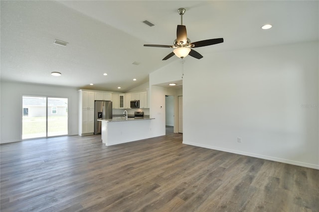 unfurnished living room featuring high vaulted ceiling, ceiling fan, dark hardwood / wood-style floors, and sink