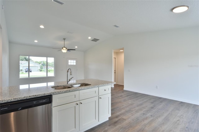 kitchen with sink, ceiling fan, lofted ceiling, hardwood / wood-style flooring, and stainless steel dishwasher