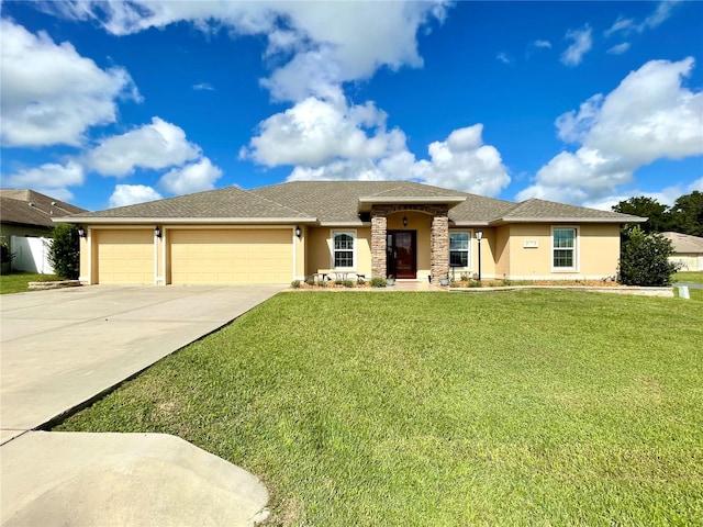 view of front of house with a garage and a front yard