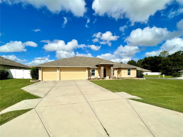 view of front of house with a front lawn and a garage