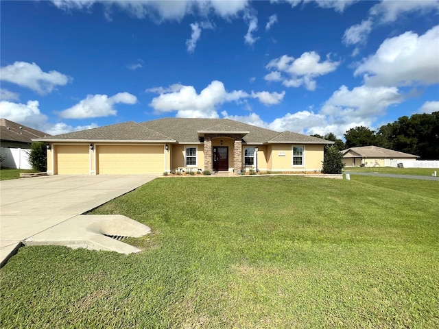 view of front of home with a garage and a front yard