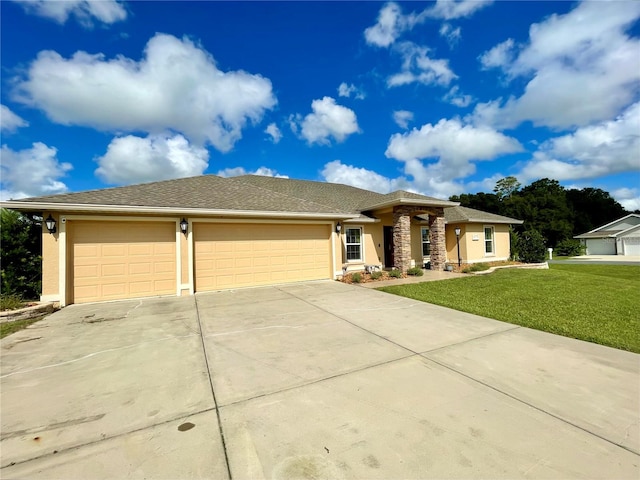 view of front of house with a garage and a front yard