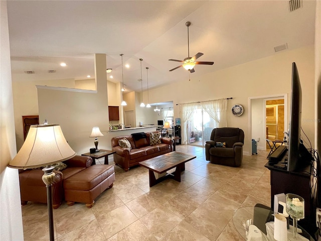 living room with ceiling fan and high vaulted ceiling