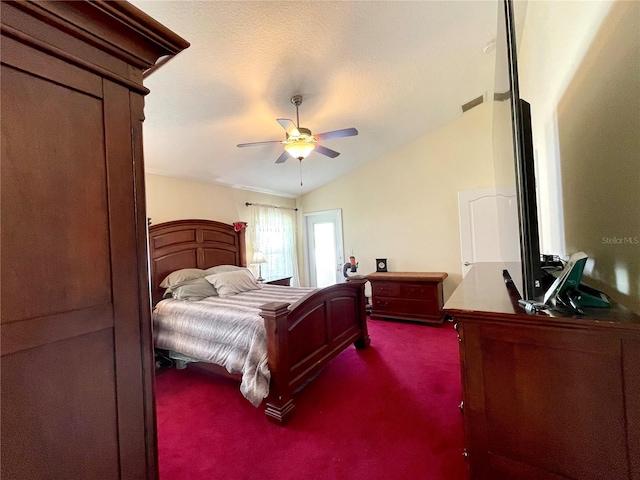 bedroom featuring a textured ceiling, lofted ceiling, ceiling fan, and carpet floors