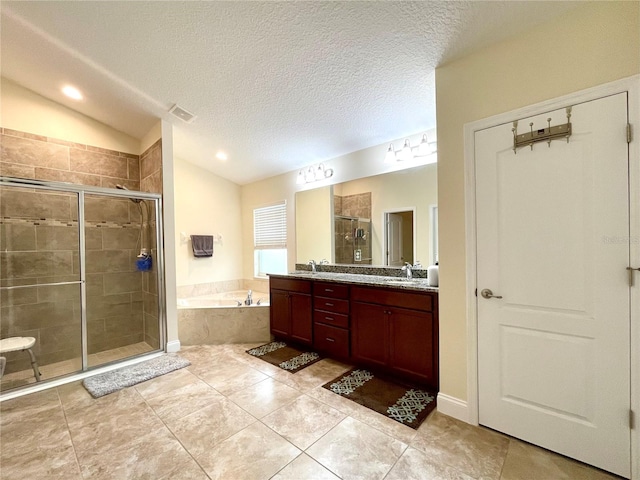 bathroom featuring lofted ceiling, vanity, shower with separate bathtub, and a textured ceiling