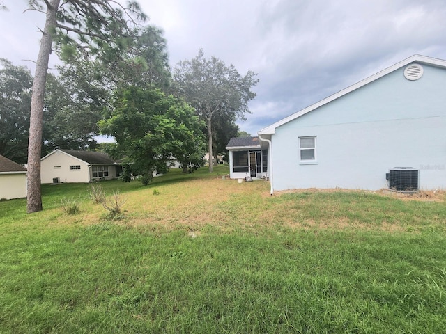 view of yard featuring central AC unit