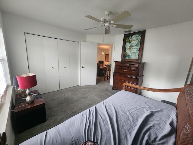 bedroom with a closet, ceiling fan, and carpet