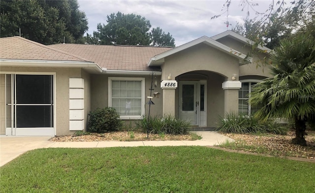 ranch-style house with a front lawn