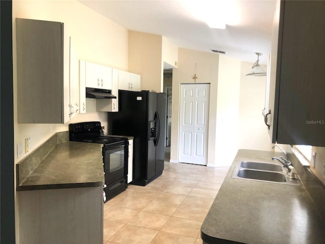 kitchen featuring black appliances, light tile patterned flooring, white cabinetry, and sink