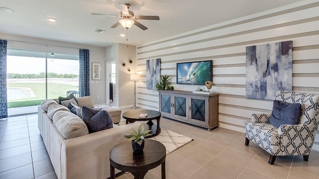 living room with light tile patterned floors and ceiling fan