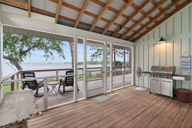 deck with a water view and a grill