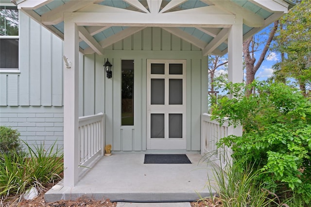 doorway to property with board and batten siding