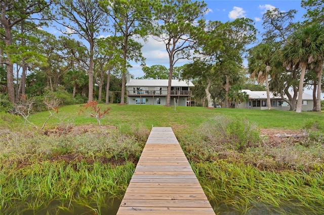 view of dock featuring a yard