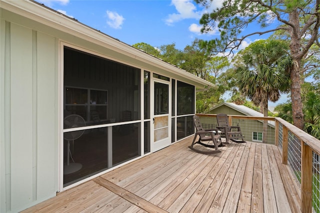 deck with a sunroom