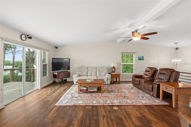 living room with ceiling fan with notable chandelier, vaulted ceiling with beams, baseboards, and wood finished floors