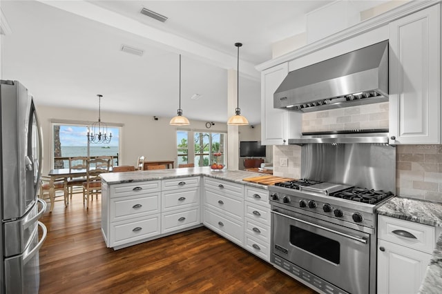 kitchen featuring range hood, a peninsula, dark wood-style flooring, stainless steel appliances, and backsplash