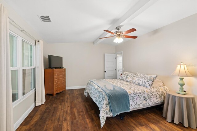 bedroom featuring visible vents, baseboards, dark wood-type flooring, and vaulted ceiling with beams