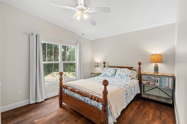 bedroom featuring vaulted ceiling, a ceiling fan, baseboards, and wood finished floors