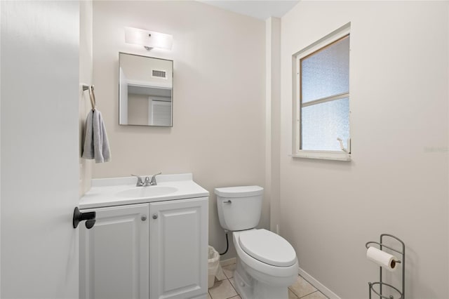 half bath featuring visible vents, toilet, tile patterned flooring, baseboards, and vanity