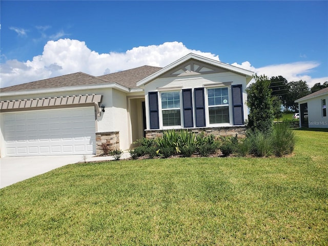 view of front of property featuring a garage and a front yard