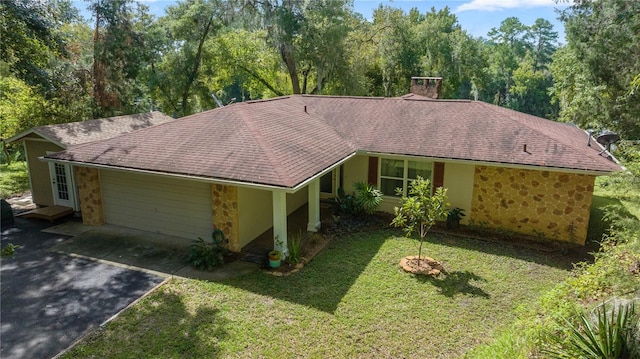 ranch-style home with a front lawn