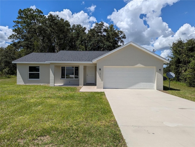 single story home featuring a front lawn and a garage