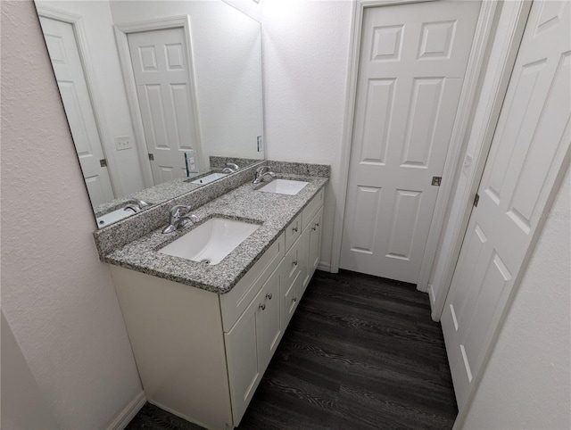 bathroom featuring vanity and hardwood / wood-style flooring