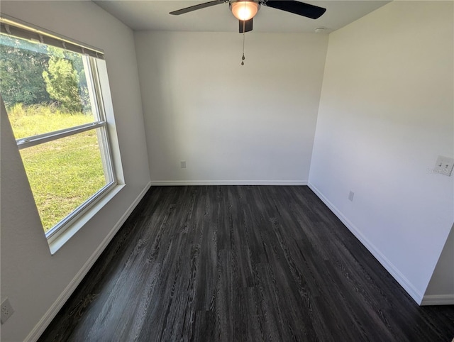 empty room featuring ceiling fan and dark hardwood / wood-style floors