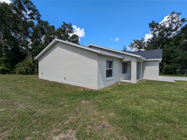 view of property exterior featuring a yard