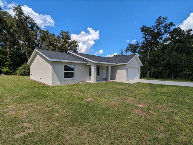 ranch-style home with a garage and a front lawn