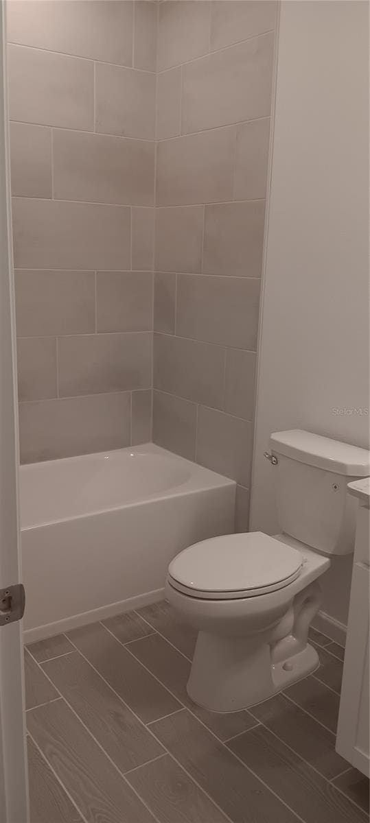 full bathroom with vanity, toilet, and tub / shower combination