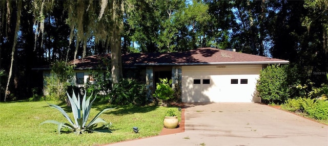 single story home with a garage and a front yard