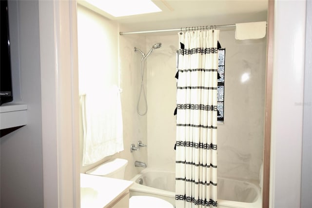 full bathroom featuring vanity, toilet, and shower / bathtub combination with curtain