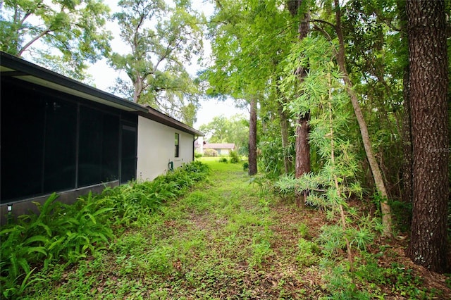 view of yard featuring a sunroom