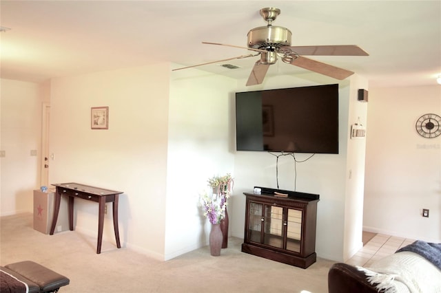 living room featuring ceiling fan and light carpet