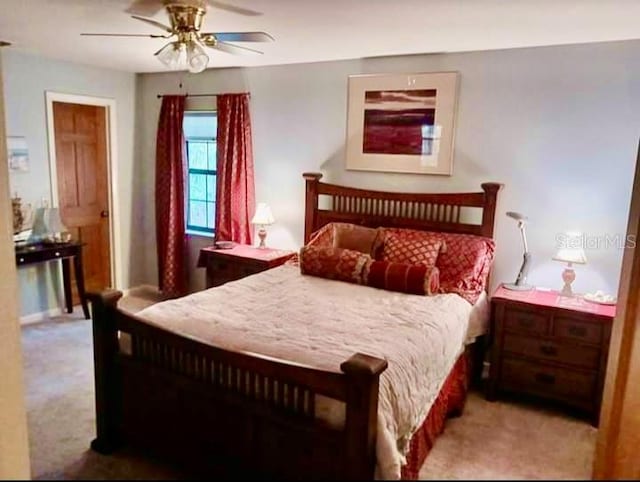 bedroom featuring light carpet and ceiling fan