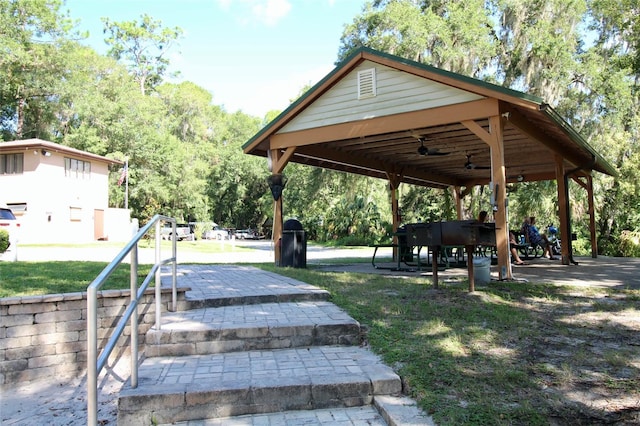 view of property's community with a yard and a gazebo